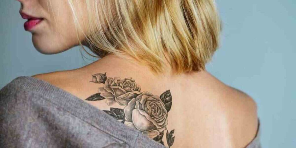 A woman with a beautifully designed back tattoo, illustrating the significance of back tattoos in personal expression and art.

